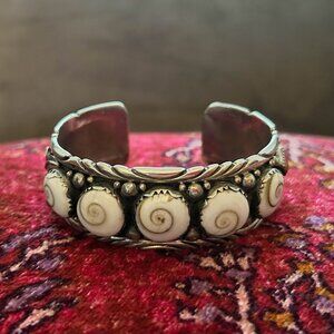 Ornate silver Thai cuff bracelet with Shiva shells and stones